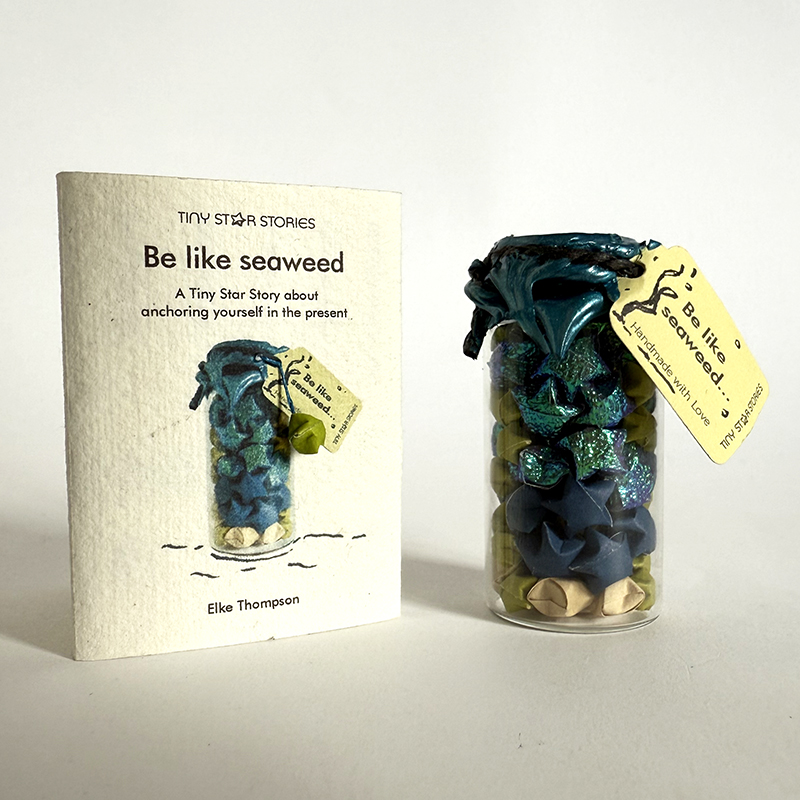 Be like Seaweed – tiny hand-finished booklet with tiny 3D hand-folded origami paper star as well as a tiny glass bottle filled with paper stars. By Elke Thompson